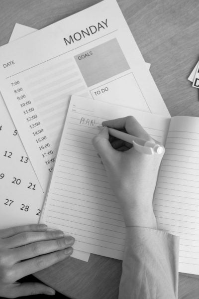 Notebook and calendar for planning [Image © Anna Nekrashevich / Pexels.com]